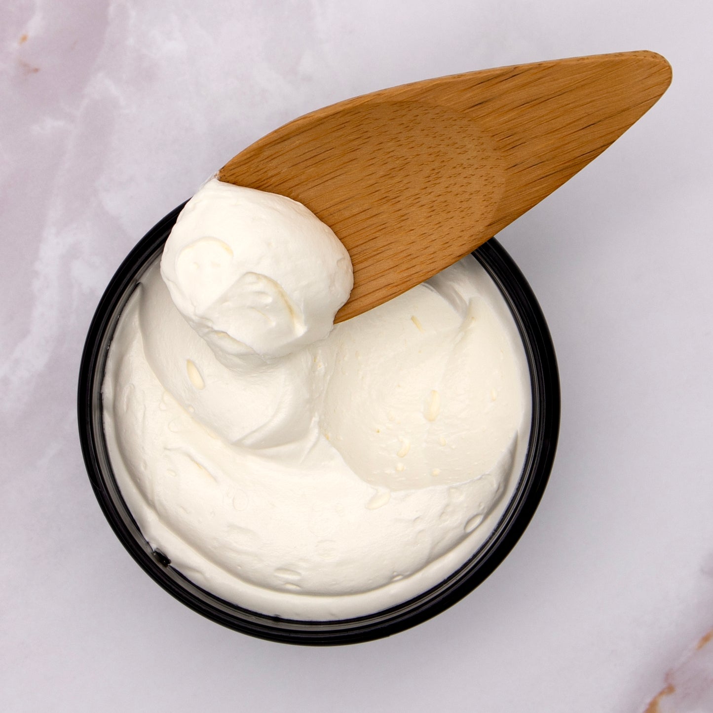 Invigorate your senses with this unique Peppermint Body Butter. Whipped with Peppermint Essential Oil, this Candy Cane in a jar will help you to get in the holiday spirit. The cocoa butter gives this Lolo a slight chocolate scent, and the Peppermint Oil reminds us of holiday treats
