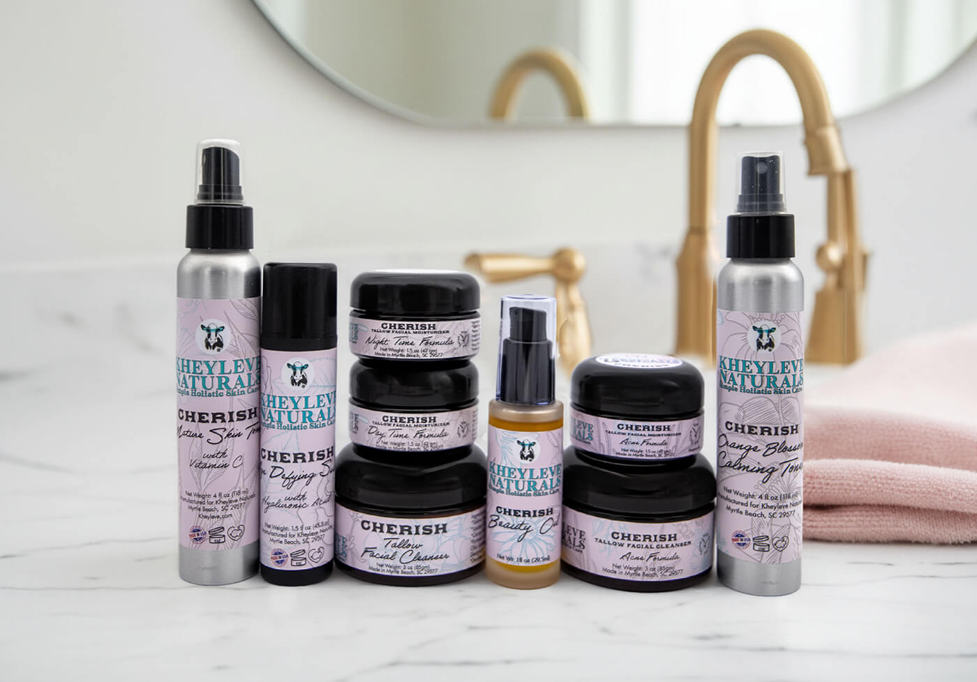 Kheyleve Naturals Cherish skincare products on a bathroom counter.