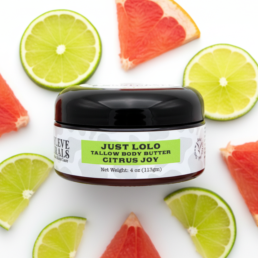 Jar of Just Lolo Citrus Joy tallow body butter surrounded by lime and grapefruit slices on a white background