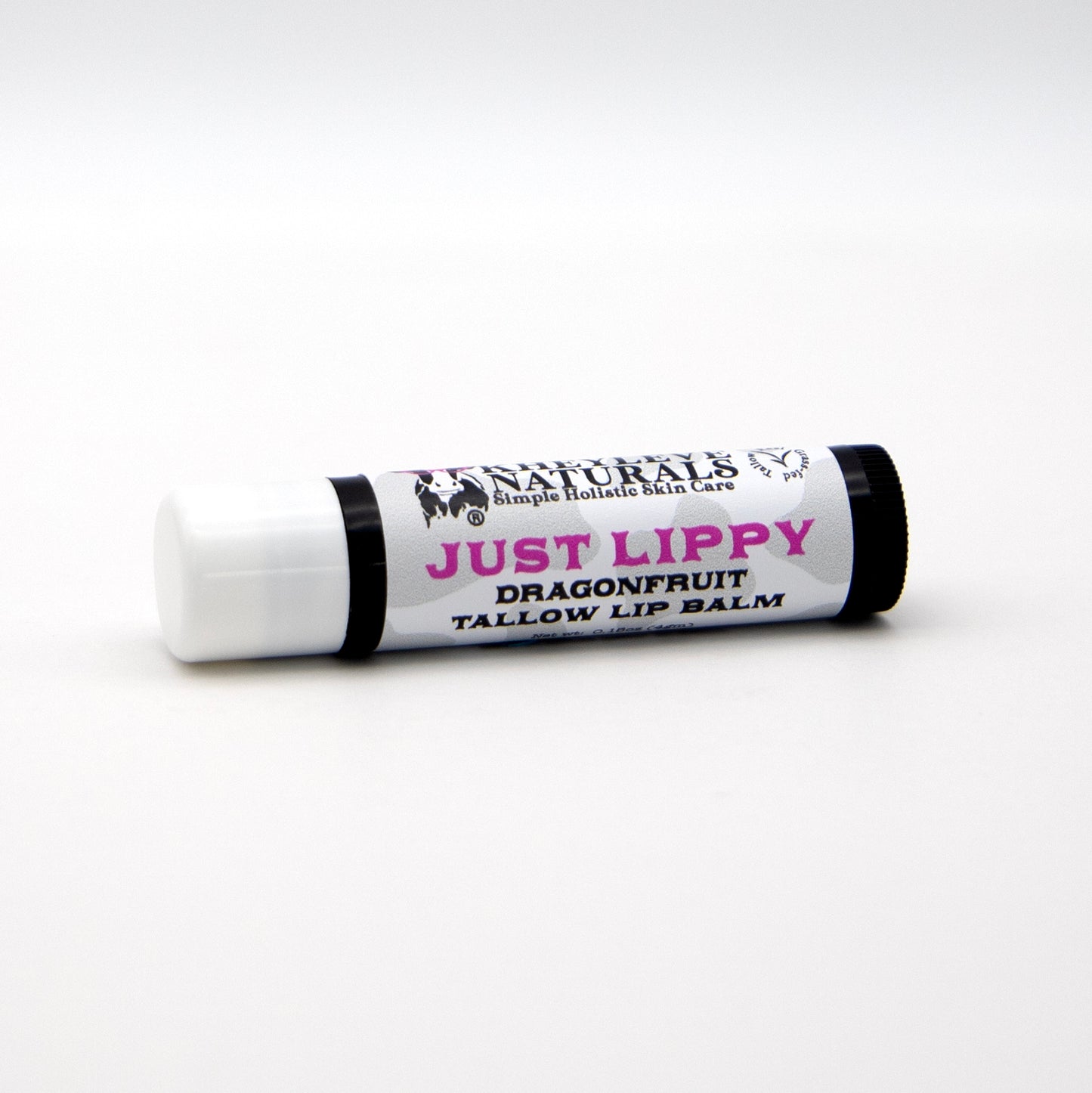 Lip balm stick with 'Just Lippy' and 'Dragonfruit' text on a white background